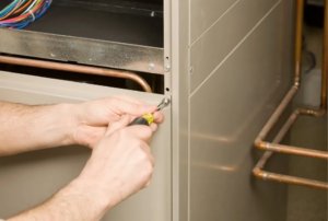 Furnace servicing by a technician, ensuring optimal performance with routine maintenance, how often should a furnace be serviced, expert furnace tune-up, professional heating system check-up, reliable furnace repair and maintenance services, seasonal furnace maintenance for energy efficiency, furnace service technician working on HVAC system. Call now for professional help with how often should a furnace be serviced, furnace maintenance schedule, furnace tune-up frequency, professional furnace servicing, furnace inspection intervals, HVAC maintenance services, furnace upkeep tips, seasonal furnace check-up, heating system maintenance, furnace maintenance near me, furnace tune-up near me, reliable furnace service, energy-efficient furnace maintenance, furnace cleaning services, regular furnace servicing, furnace technician near me, heating system inspection, furnace repair services, expert furnace maintenance, local furnace servicing, furnace care schedule, routine furnace check-ups.