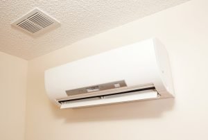 An installed ductless mini split air conditioner unit on a textured ceiling, featuring a vent and a modern, sleek design. This image is ideal for showcasing the practical and aesthetic aspects of indoor cooling solutions in residential settings.An installed ductless mini split air conditioner unit on a textured ceiling, featuring a vent and a modern, sleek design. This image is ideal for showcasing the practical and aesthetic aspects of indoor cooling solutions in residential settings. ductless mini split, air conditioner installation, indoor cooling system, energy-efficient AC, modern air conditioning, HVAC services, Sacramento AC installation, Roseville ductless system, Rocklin cooling solutions, Folsom air conditioner, Auburn HVAC expert, Citrus Heights cooling technology