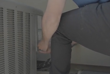 HVAC technician repairing residential furnace during home heating service