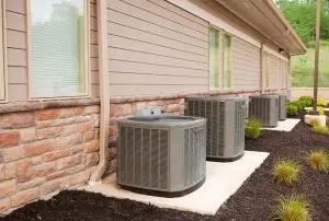 Three AC units lined up on a building: Troubleshoot why your AC is blowing warm air with expert tips. Lochard HVAC, Plumbing and Service offers AC repair in Sidney, Piqua, and Troy. Keywords: AC blowing warm air, troubleshoot AC problems, HVAC repair, AC unit maintenance, Lochard HVAC, expert AC repair, Sidney OH AC services, Piqua OH HVAC repair, Troy OH air conditioning maintenance, cooling system troubleshooting. AC Repair Troy, AC Repair Piqua, AC Repair Sidney, AC Repair Bellefontaine, AC Repair Tipp City, AC Repair Wapakoneta, AC Repair Celina, AC Repair St. Marys, AC Repair Versailles, AC Repair New Bremen, AC Repair Anna, AC Repair Minster, AC Repair Covington, AC Repair St. Paris, AC Repair Botkins, AC Repair Russia, AC Repair Ft. Loramie, AC Repair De Graff, AC Repair Jackson Center, AC Repair Quincy, AC Repair Houston, AC Repair West Milton, AC Repair Bradford, AC Repair Indian Lake, AC Repair Casstown, AC Repair Kettlersville